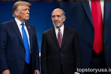 Two men in formal business attire standing together at official event with American flag backdrop