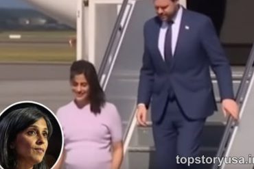 JD Vance viral video showing man in navy suit descending airplane stairs with woman in pink