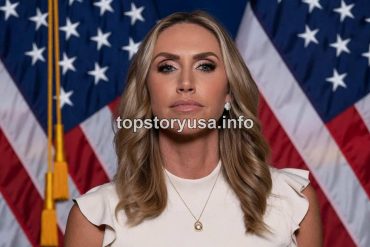Lara Trump RNC Co-Chair portrait with American flags background in professional white sleeveless top