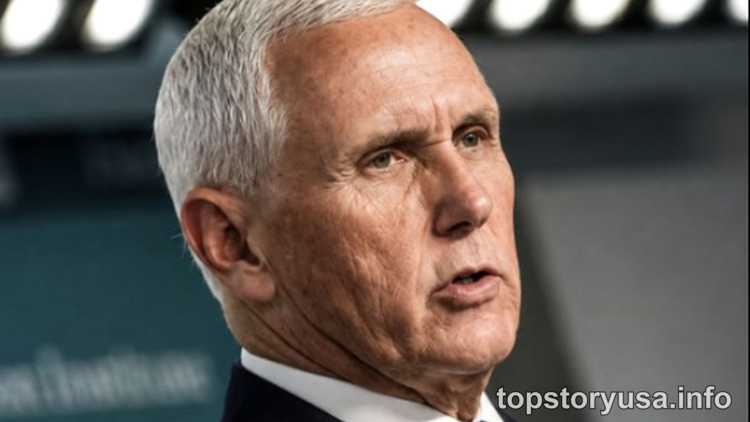 Mike Pence emotional address speaking at podium with serious expression during public event